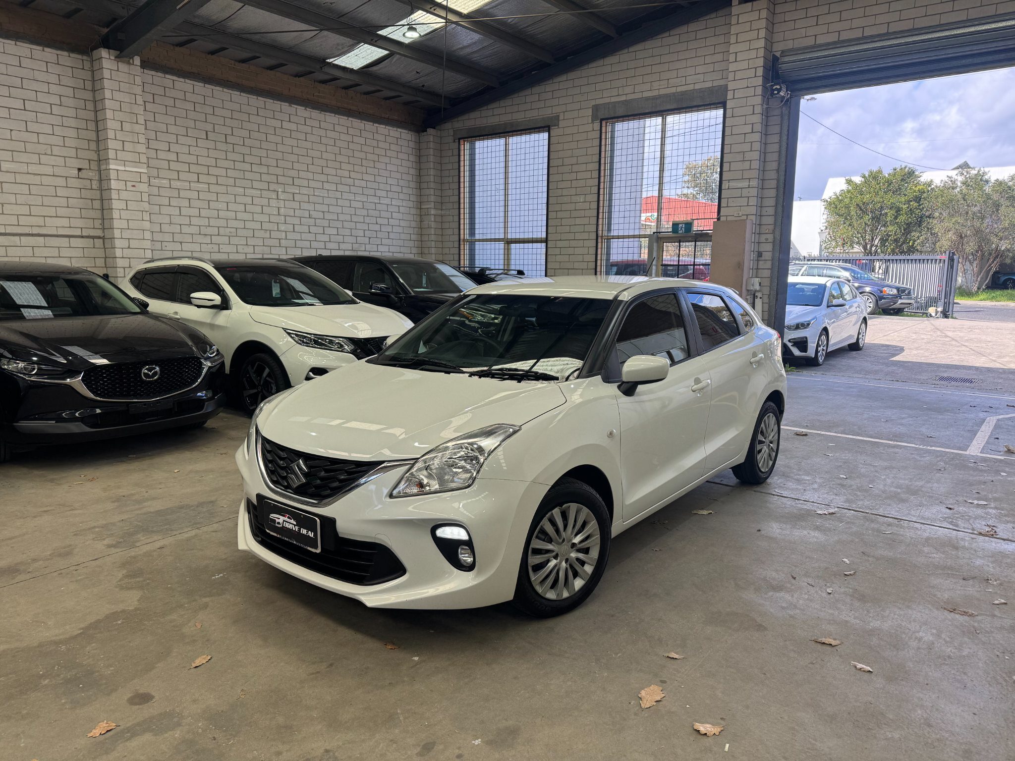 2021 Suzuki Baleno GL Hatchback Petrol Automatic white for sale at Drive Deals image 1